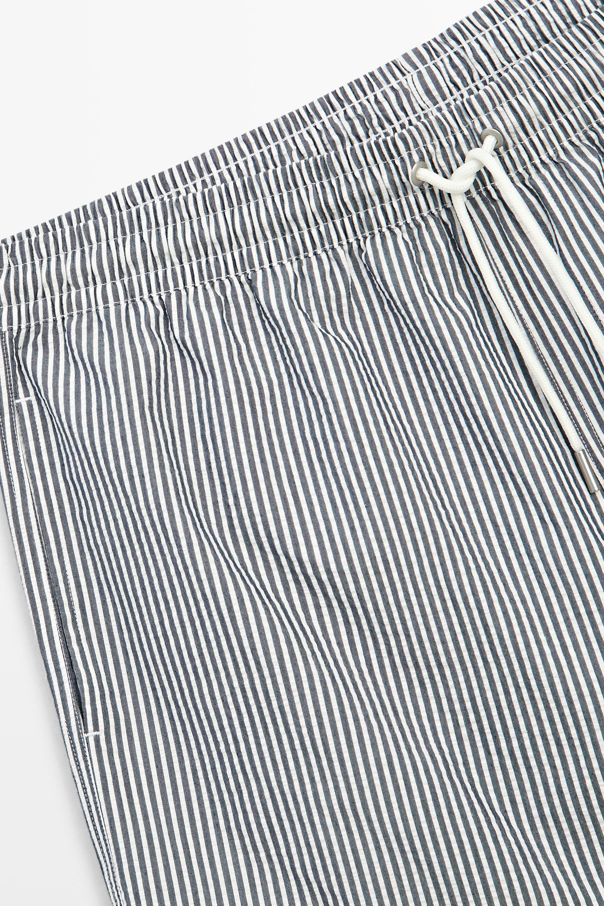 Swimming trunks with striped details